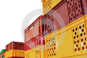 Stack of colorful plastic crates or boxes for transporting bakery and food products