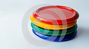 A stack of colorful plastic plates