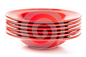 Stack of colorful red ceramics plates