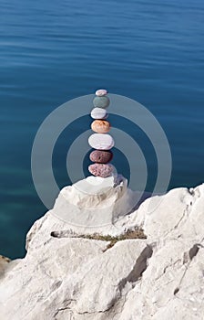 Stack of colorful zen stones on the rock