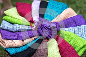 Stack of colourful silk scarfs