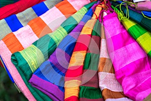 Stack of colourful silk scarfs