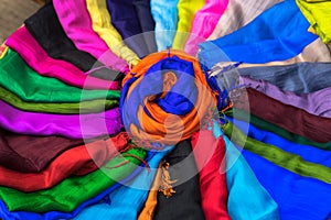 Stack of colourful silk scarfs