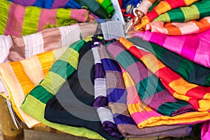 Stack of colourful silk scarfs