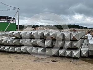 Stack of concrete blocks, construction site against a blue sky