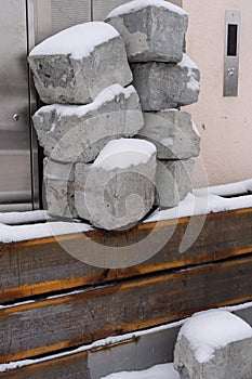 stack of concrete blocks, construction site against a blue sky