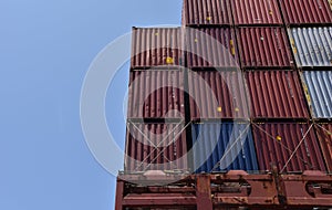 Stack of containers with cargo, loaded on deck of the container ship.