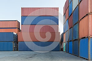 Stack of containers in a harbor. Shipping containers stacked on cargo ship. Background of Stack of Containers at a Port.