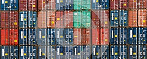 Stack of containers in a harbor. Shipping containers stacked on cargo ship. Background of Stack of Containers at a Port.