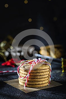 a stack of cookies tied with a Christmas ribbon