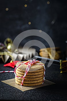 a stack of cookies tied with a Christmas ribbon