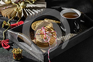 a stack of cookies tied with a Christmas ribbon