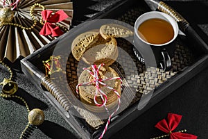 a stack of cookies tied with a Christmas ribbon