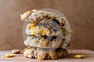 Stack of Cornflake Cookies on wooden surface.
