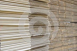 stack of corrugated cardboard boxes. egde view of flattened boxes.