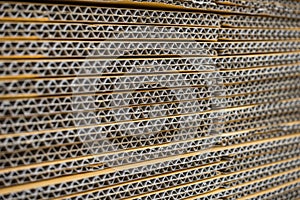 stack of corrugated cardboard boxes. egde view of flattened boxes.