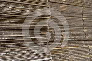 stack of corrugated cardboard boxes. egde view of flattened boxes.