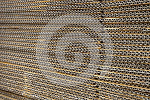 stack of corrugated cardboard boxes. egde view of flattened boxes.