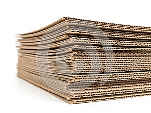 Stack of corrugated cardboard sheets isolated on white background