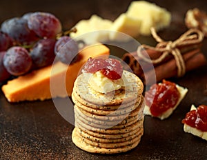 Stack of crackers with apple chutney and other snacks