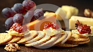 Stack of crackers with apple chutney and other snacks