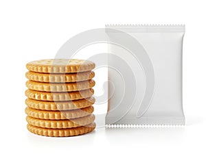 Stack of crackers and packaging isolated on white background