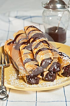 Stack of crepes filled with chocolate hazelnut ganache