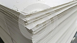 A stack of crisp smooth printmaking paper waiting to be transformed into beautifully printed works of art with the use photo