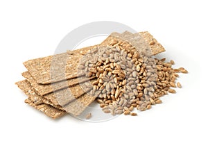 Stack of  crispbread and wheat grains