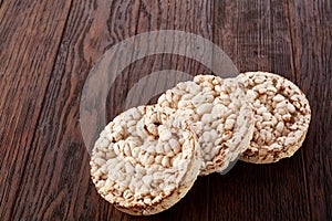 Stack of crispbreads on dark wooden table