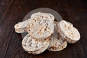 Stack of crispbreads on dark wooden table