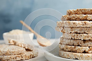 Stack of crunchy rice cakes on table, closeup.