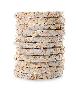 Stack of crunchy rice cakes on white background