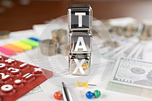 A stack of cubes with the word tax written on them