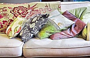 Stack of cushions on sofa photo