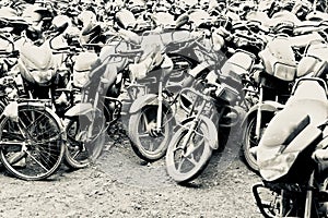 Stack of damaged motorbikes isolated photo