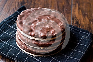 Stack of dark chocolate covered rice cakes or corn crackers