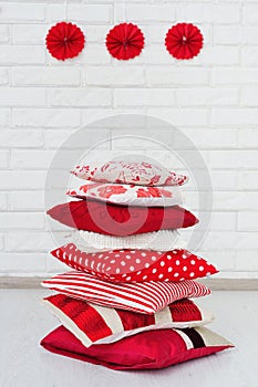 Stack of decorative red pillows