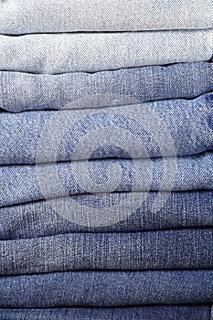 Stack of denim Blue jeans detail, pattern, texture, Background of denim canvas