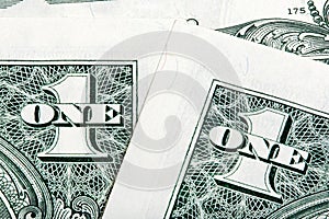 Stack details of one dollar bills close-up shot.