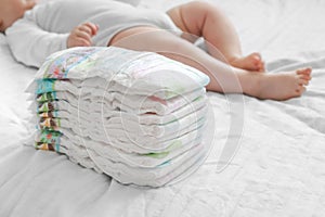 Stack of diapers on bed