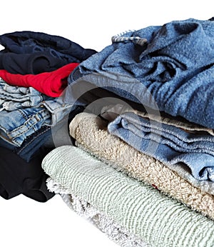 Stack of different clean clothes isolated on white background, close-up.
