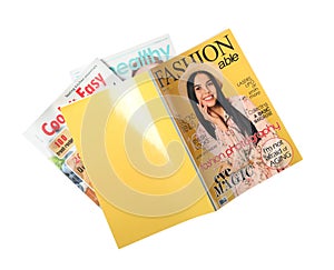 Stack of different magazines on white, top view