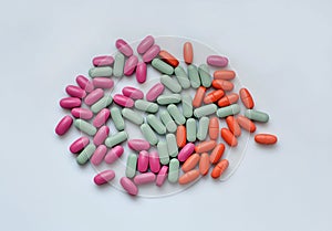 Stack of different pills  on white background