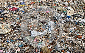 Stack of different types of large garbage dump, plastic bags, and trash bins in urban area in Environmental pollution concept