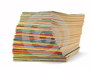 A stack of dimes novels isolated against a white background