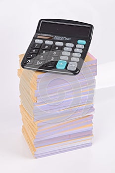 Stack of documents and calculator