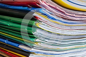 Stack of documents placed on a business desk in a business office. Stack or cabinet of document files in the office, business,