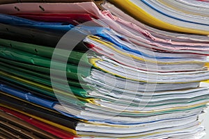Stack of documents placed on a business desk in a business office. Stack or cabinet of document files in the office, business,
