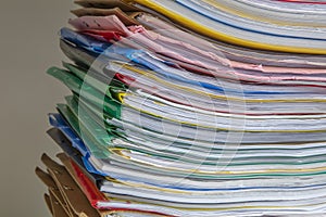 Stack of documents placed on a business desk in a business office. Stack or cabinet of document files in the office, business,